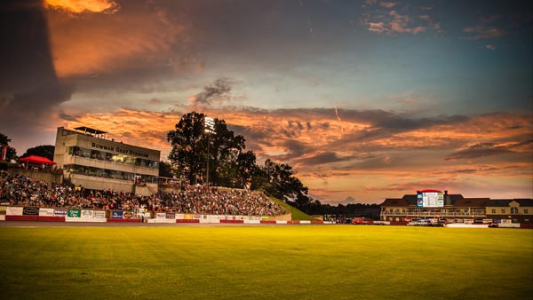 Bowman Gray Stadium is lit up by a gorgeous summer sunset